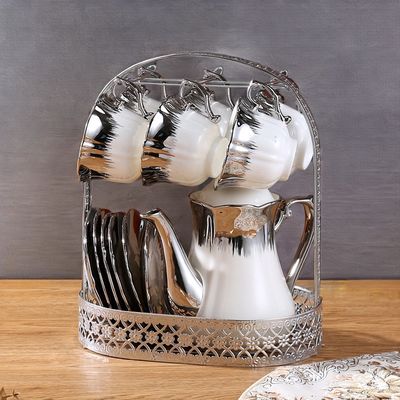 Πορσελάνινη τσαγιέρα και φλιτζάνι για πορτοκάλι, που δημιουργεί το design της Ευρώπης για μια πολυτελή εμπειρία καφέ και τσαγιού